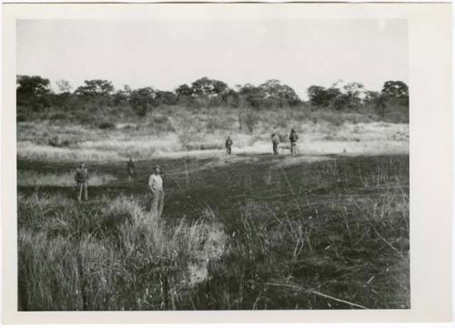 "1950 - 300 series duplicates": Expedition members standing near elephant trail