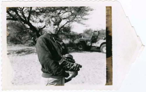 [No folder]: John Marshall holding his film camera