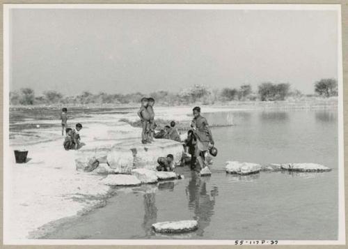 Women and children at the edge of Nama Pan (print is a cropped image)