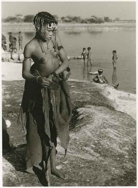 !Ungka's cousin, standing, with other unidentified people and Nama Pan in the background (print is a cropped image)