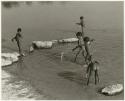 Children playing in the water (print is a cropped image)