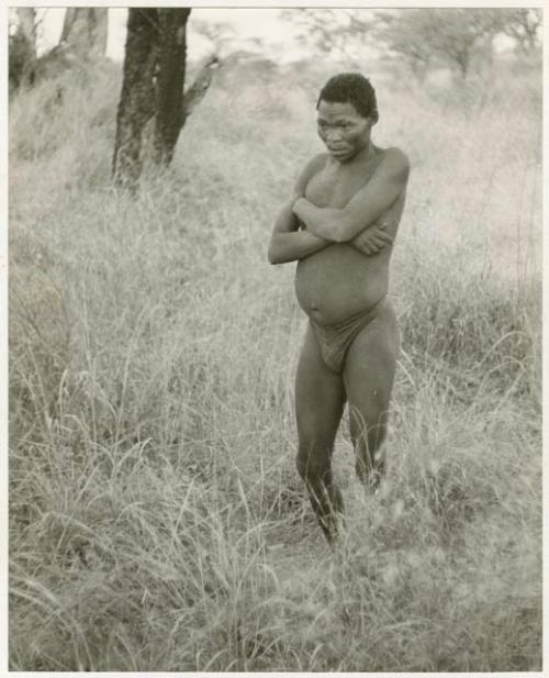 "/Qui Navel" standing in grass (print is a cropped image)