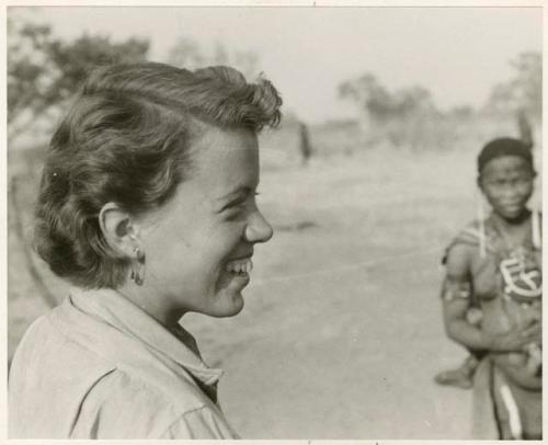 Elizabeth Marshall Thomas wearing a safety-pin earring, with a woman standing in the background (print is a cropped image)


























