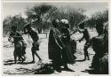 [No folder title]: Group of people performing the Eland Dance, including two men wearing horns (from color slide 2001.29.8653)