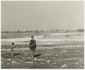 Women and children approaching Nama Pan, distant view (print is a cropped image)