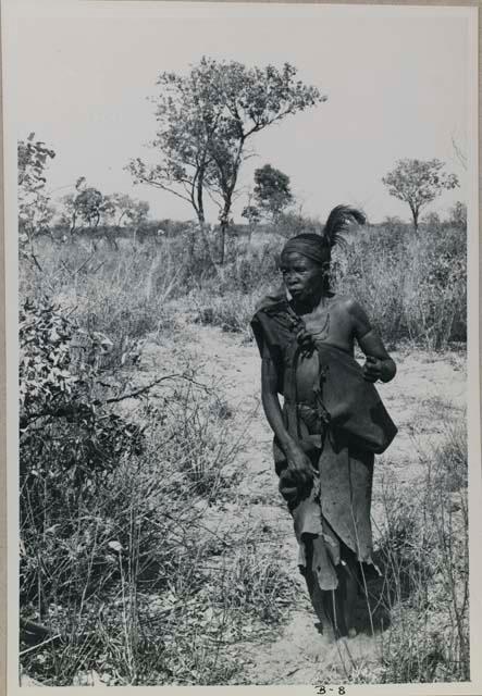 [No folder title]: Woman walking, part of a menstruation ceremony


