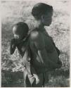 [No folder title]:Tsekue carrying N!whakwe on her back




