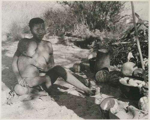 [No folder title]: N!whakwe sitting on Tsekue's lap






