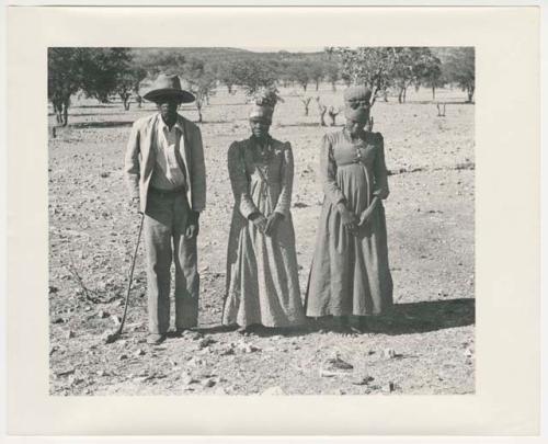 "1950's 400 series": Man and two women standing (print is a cropped image)