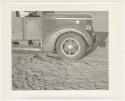 "1950's 400 series": Front of expedition truck, with sand and chains (print is a cropped image)