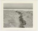"1950's 400 series": Ditch on shore, with water in background (print is a cropped image)