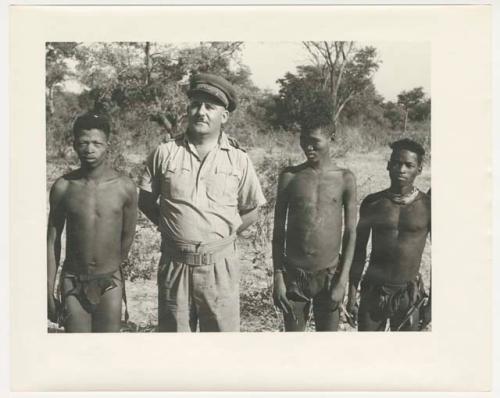 "Glossy duplicates of / 1950 Merl La Voy prints / 400 series": Group of men standing in a line (print is a cropped image)