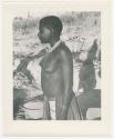 "Glossy duplicates of / 1950 Merl La Voy prints / 400 series": Woman standing (print is a cropped image)