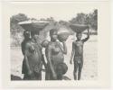 "1950 '400 Series' / 87 B/W prints (some duplicates) / Ovamboland": Women carrying baskets on their heads and babies on their backs (print is a cropped image)