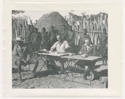 "1950 '400 Series' / 87 B/W prints (some duplicates) / Ovamboland": Government officials collecting grain tax from Ovambo people (print is a cropped image)