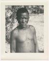 "1950 '400 Series' / 87 B/W prints (some duplicates) / Ovamboland": Man standing, portrait (print is a cropped image)