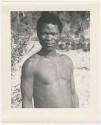 "1950 '400 Series' / 87 B/W prints (some duplicates) / Ovamboland": Man standing, portrait (print is a cropped image)