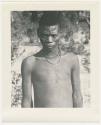 "1950 '400 Series' / 87 B/W prints (some duplicates) / Ovamboland": Man standing, portrait (print is a cropped image)