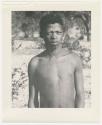 "1950 '400 Series' / 87 B/W prints (some duplicates) / Ovamboland": Man standing, portrait (print is a cropped image)