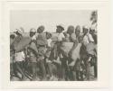 "1950 '400 Series' / 87 B/W prints (some duplicates) / Ovamboland": Large group of people standing in line next to trucks (print is a cropped image)