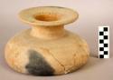 Ceramic; brown ware jar; flat base; extended, constricted neck; flared, disk-lik