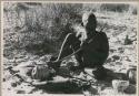 [No folder title]: Oukwane playing a musical bow, seated







