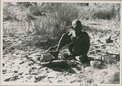 [No folder title]: Oukwane playing a musical bow, seated






