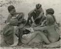 [No folder title]:  Boys of Oukwane's group and "visiting group" sitting by a fire




