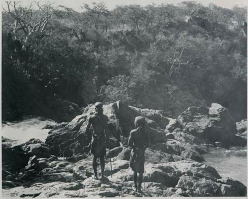 "1950 '400 Series' / 41 prints": Two men standing at the top of Ruacana Falls (print is a cropped image)