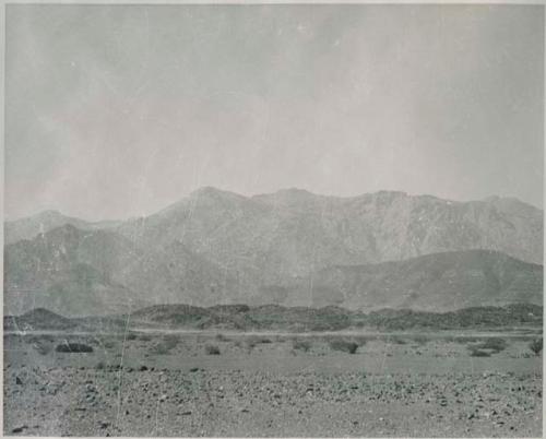 "1950 400 series  43 prints / Kunene River, Kaokoveld, Ovamboland / Merle LaVoy & L.K.M": Landscape, with mountains in background (print is a cropped image)