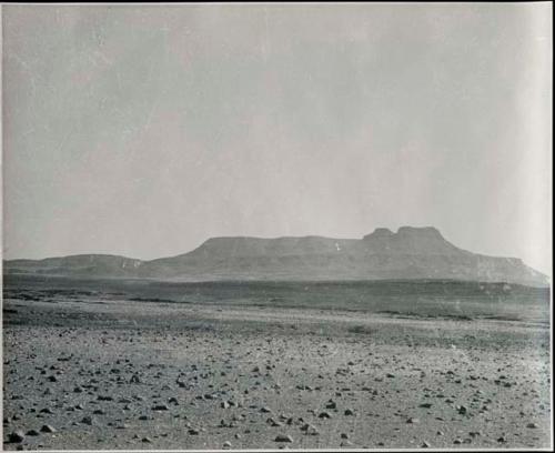 "1950 400 series  43 prints / Kunene River, Kaokoveld, Ovamboland / Merle LaVoy & L.K.M": Landscape, with mountains in background (print is a cropped image)