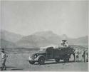 "1950 400 series  43 prints / Kunene River, Kaokoveld, Ovamboland / Merle LaVoy & L.K.M": People standing next to a truck (print is a cropped image)