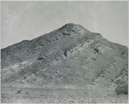 "1950 400 series  43 prints / Kunene River, Kaokoveld, Ovamboland / Merle LaVoy & L.K.M": View of hill, showing tipped strata (print is a cropped image)