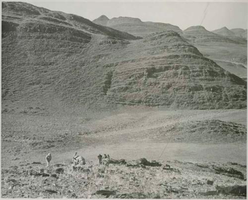 "1950 400 series  43 prints / Kunene River, Kaokoveld, Ovamboland / Merle LaVoy & L.K.M": Men looking for tin (print is a cropped image)