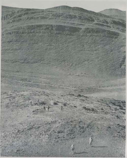 "1950 400 series  43 prints / Kunene River, Kaokoveld, Ovamboland / Merle LaVoy & L.K.M": Men looking for tin (print is a cropped image)