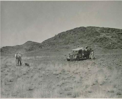 "1950 400 series  43 prints / Kunene River, Kaokoveld, Ovamboland / Merle LaVoy & L.K.M": Expedition members standing near the truck (print is a cropped image)