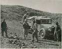 "1950 400 series  43 prints / Kunene River, Kaokoveld, Ovamboland / Merle LaVoy & L.K.M": Expedition members standing in front of truck (print is a cropped image)