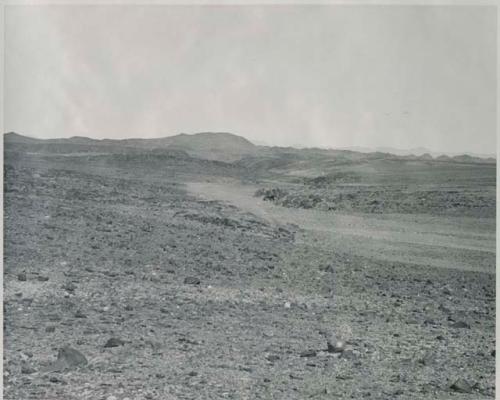 "1950 400 series  40 prints / Kaokoveld": Track, with hills in the distance (print is a cropped image)