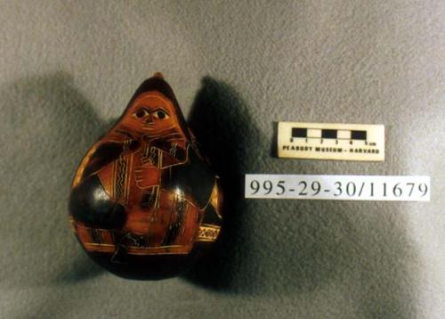 Carved and incised gourd depicting a person