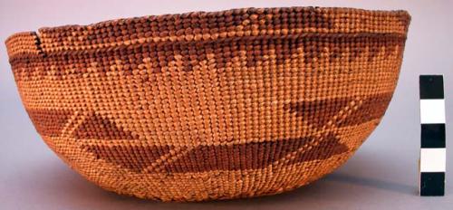 Twined basketry cap. Yellow background w/ brown geometric designs