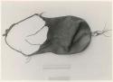 [No folder title]: Bag, with ruler for measurement (print is a cropped image)