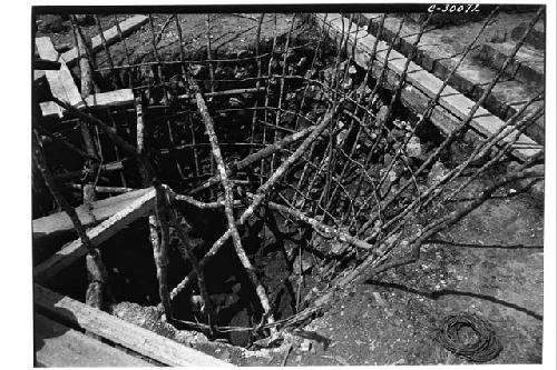 Caracol. Trench at base of upper stairway showing poles placed to prevent walls