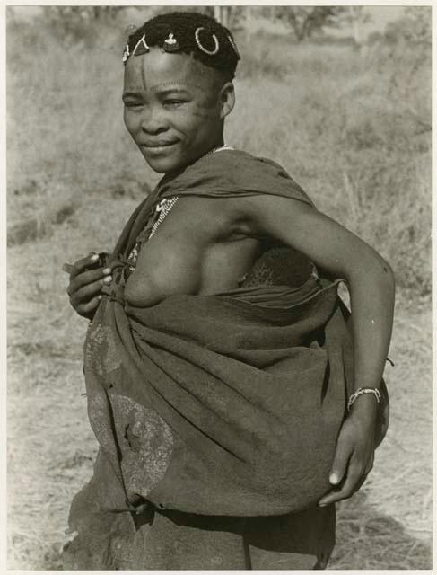 [No folder title]: Woman holding a baby in her kaross (print is a cropped image)