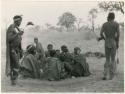 [No folder title]: Men dancing around a gathering of women (print is a cropped image)