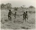 [No folder title]: Ju/'hoan boys running, seen from behind (print is a cropped image)