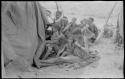 Women waiting outside a tent in which expedition members are dressing /Naoka (/Qui's second wife) and her daughter, /Khoa