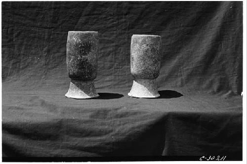 T. of Wall Panels. Cylindrical jars found at S. end of passage between bench and