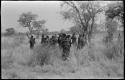 Group of Ju/'hoansi waving goodbye to the expedition