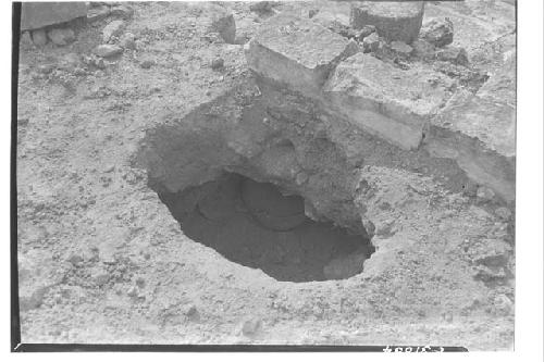 Olla under masonry block at Caracol