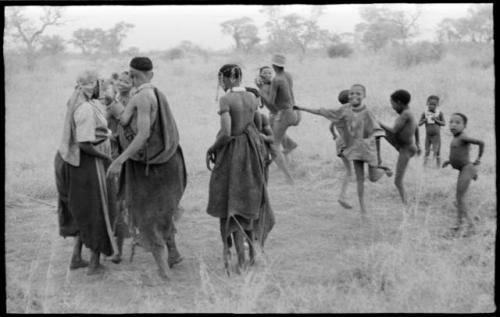 Women and children playing a game